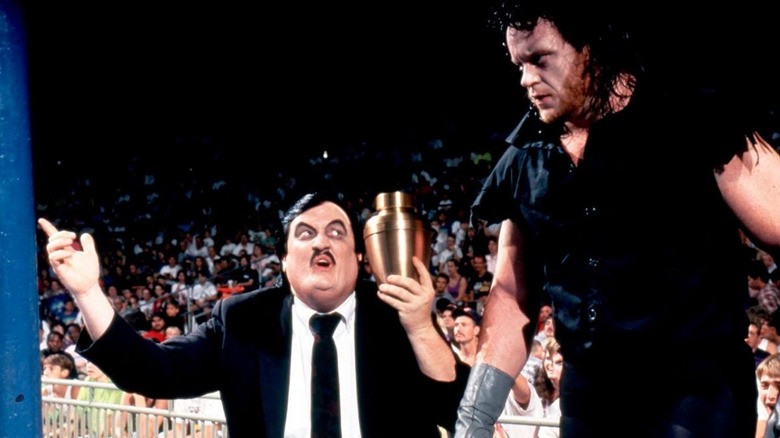 Paul Bearer and The Undertaker enter the ring