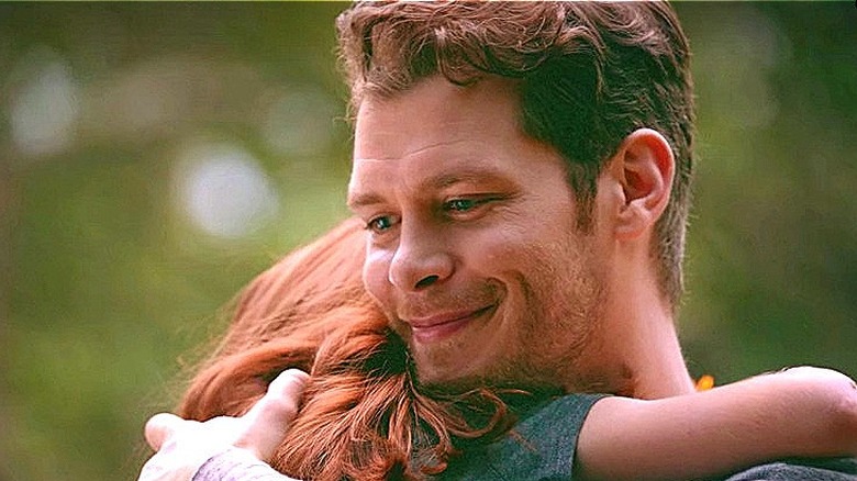 Klaus smiling and holding Hope in The Originals