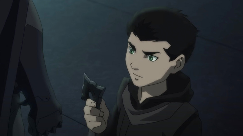 Damian Wayne looking at shuriken