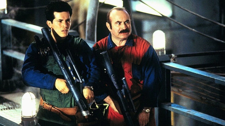 John Leguizamo and Bob Hoskins with prop guns