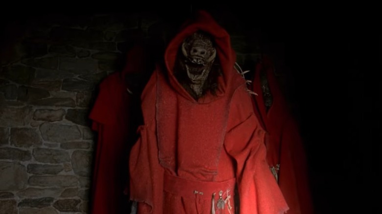 The Village monster in a red robe