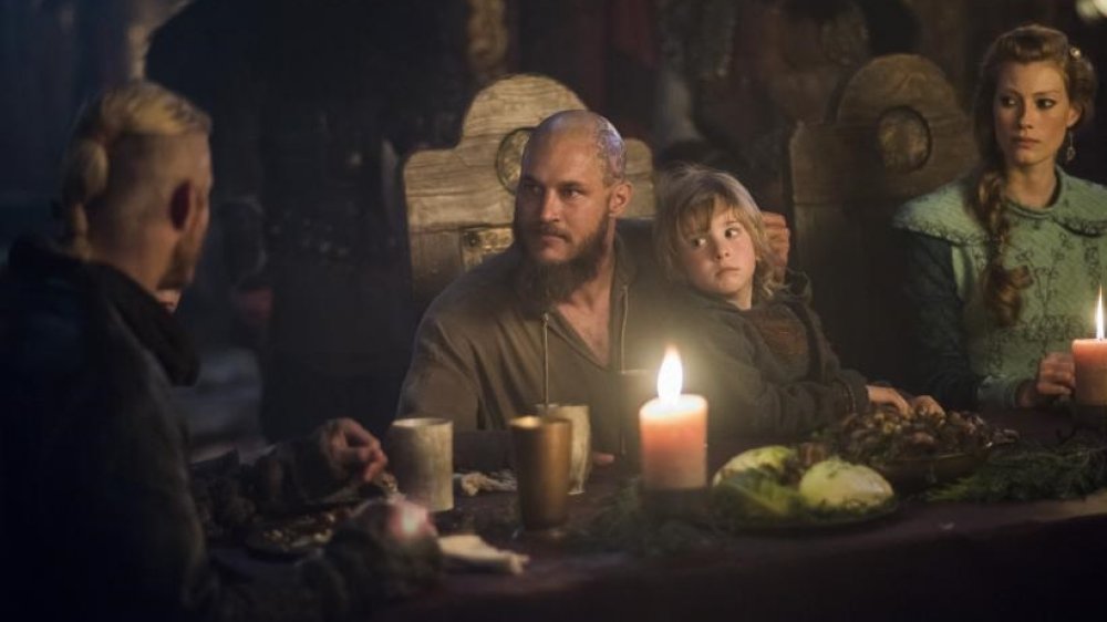 Alexander Ludwig as Bjorn, Travis Fimmel as Ragnar, James Quinn Markey as Ivar and Alyssa Sutherland as Aslaug in Vikings