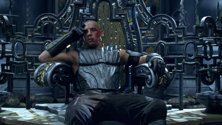 Riddick collapses on the throne