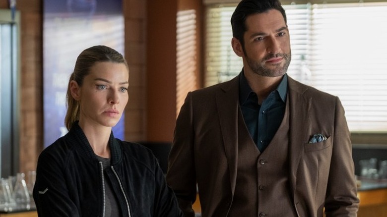 Lauren German and Tom Ellis look bored