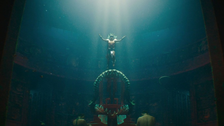 Namor floating above his throne underwater