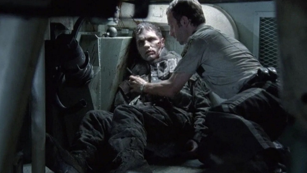 Rick Grimes in a tank with a walker