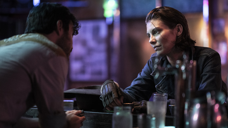 Maggie talking to a bartender