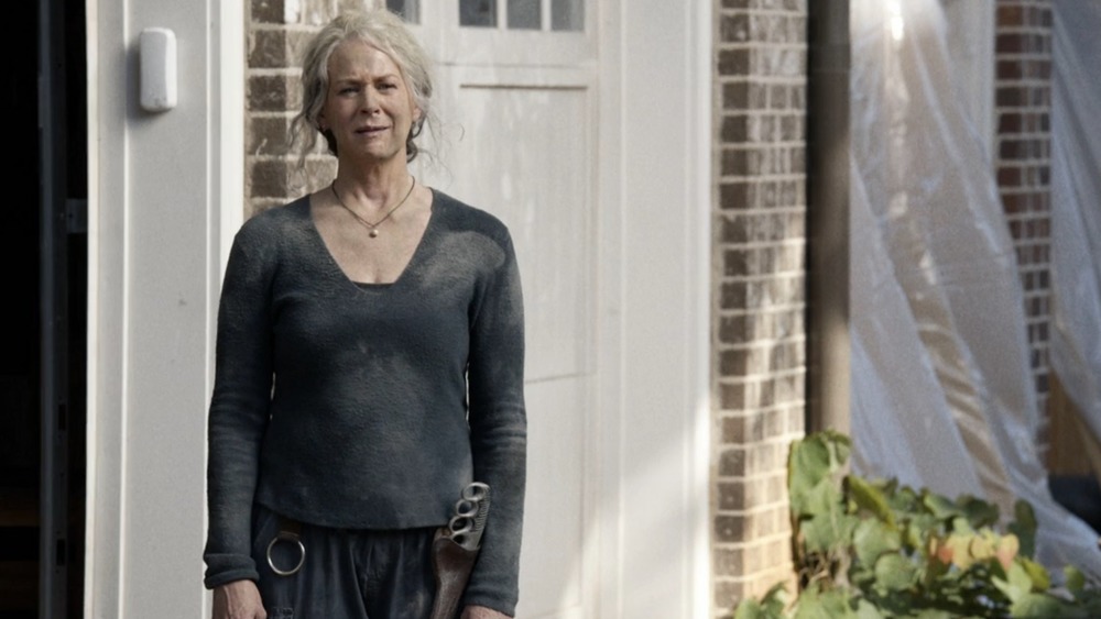 Melissa McBride Carol standing by front door