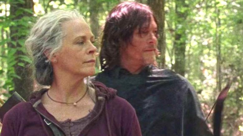 Daryl and Carol hunting on The Walking Dead