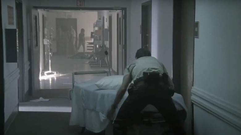 Shane barricades Rick in the hospital room