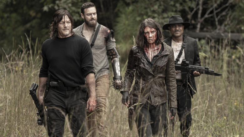 Norman Reedus as Daryl Dixon, Ross Marquand as Aaron, Lauren Cohan as Maggie Rhee, Seth Gilliam as Father Gabriel Stokes looking beaten down