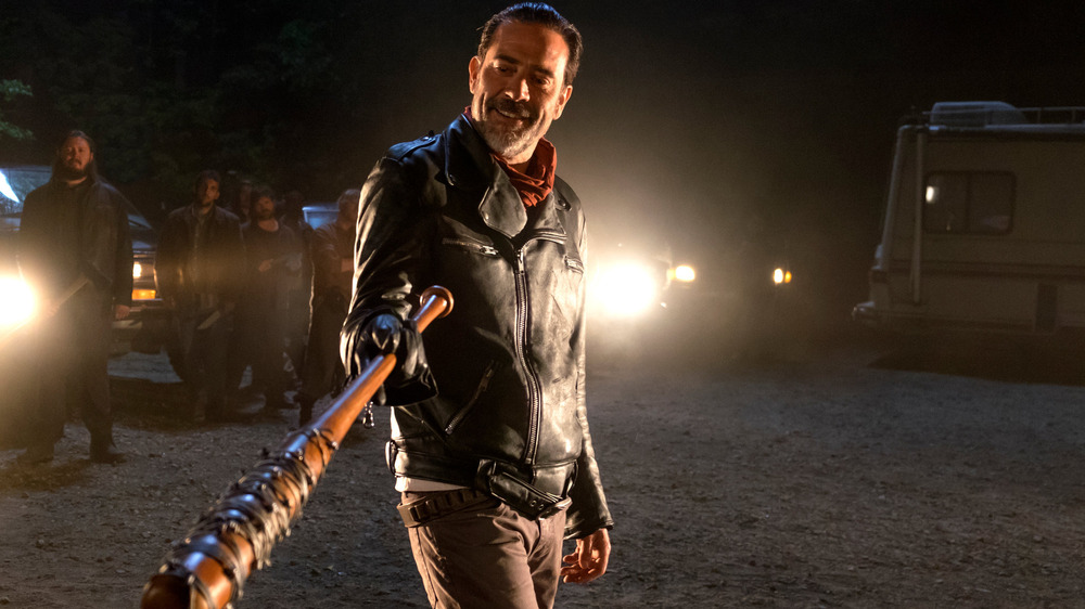 Negan smiling and brandishing Lucille