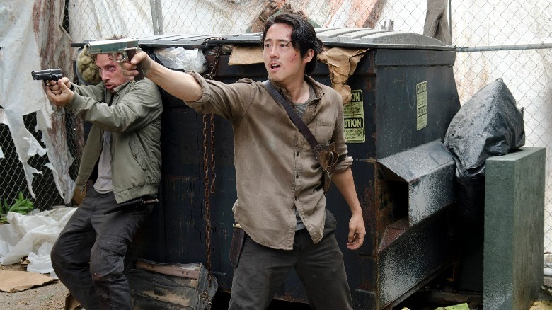 Glenn and Nicholas holding their guns