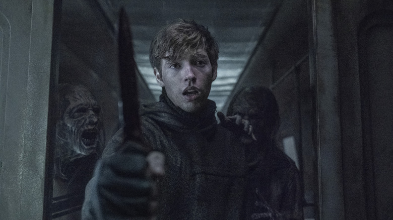Gage on 'The Walking Dead' holding knife