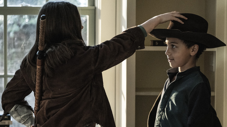 Judith giving RJ her hat on The Walking Dead