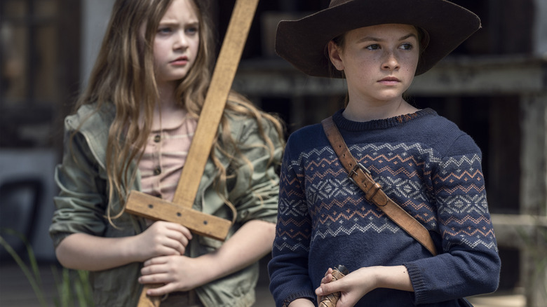 Judith and Gracie with weapons