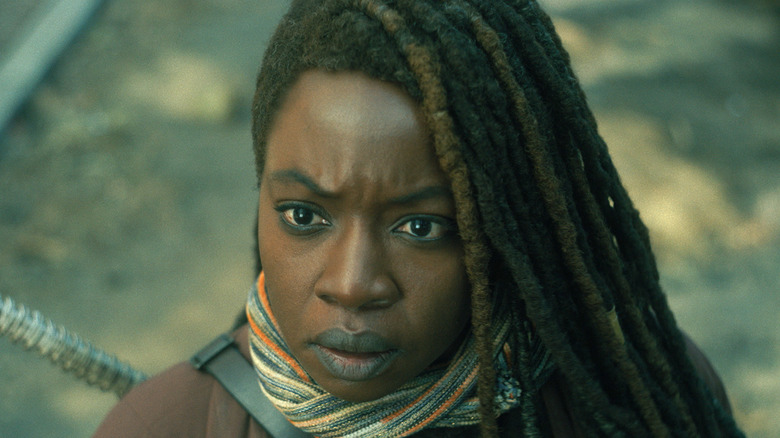 Michonne with scarf looking surprised