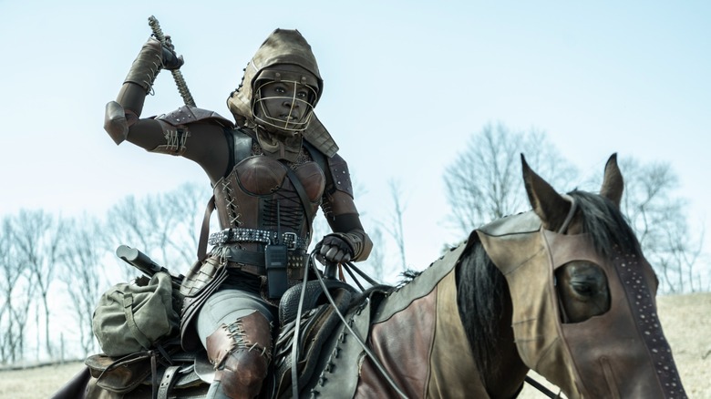 Michonne on horseback wielding katana