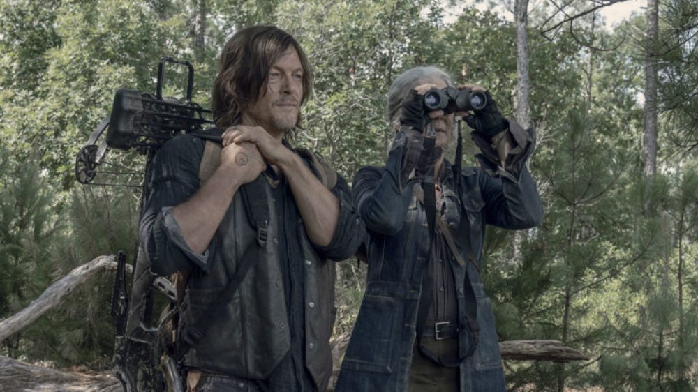 Norman Reedus as Daryl Dixon and Melissa McBride at Carol Peletier in AMC's The Walking Dead