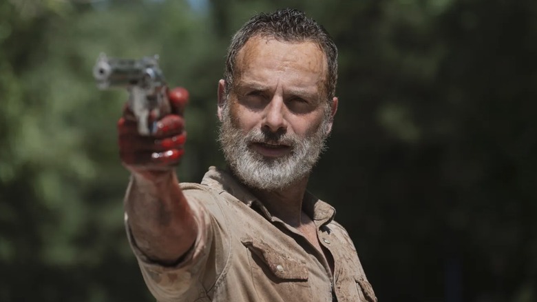 Rick Grimes pointing a pistol