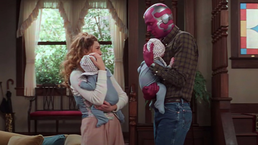 Wanda and Vision holding Billy and Tommy