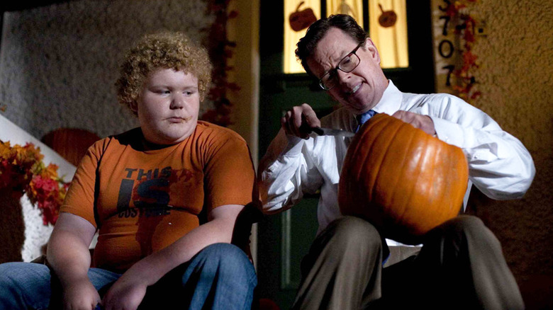 Dylan Baker carving a pumpkin