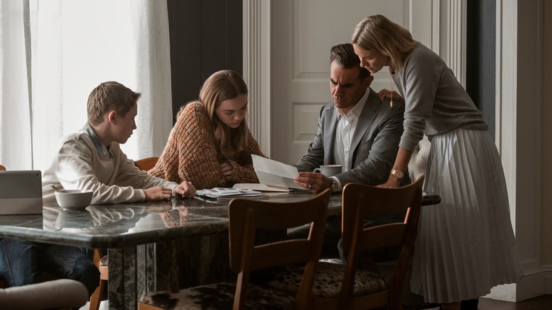 The Brannock family huddled around the letter