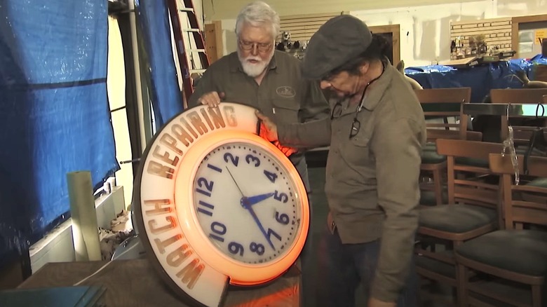 American Pickers holding clock