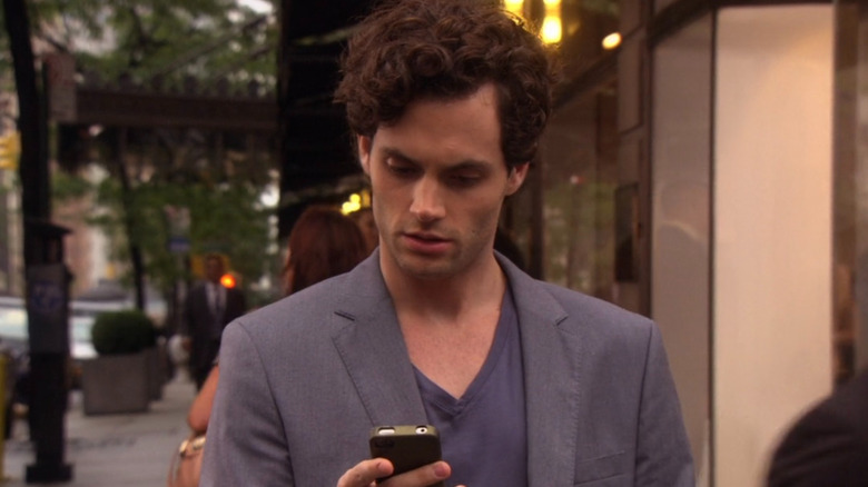 Dan Humphries looking at phone