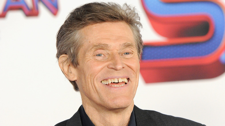 Willem Dafoe smiling