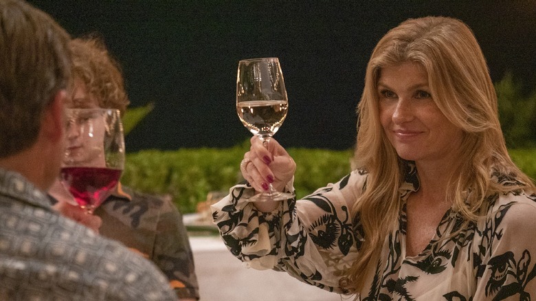 Connie Britton raising wine glass