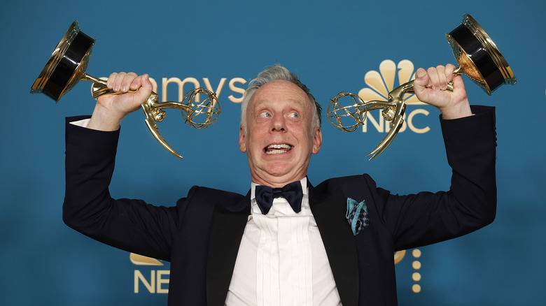 Mike White holding two Emmys