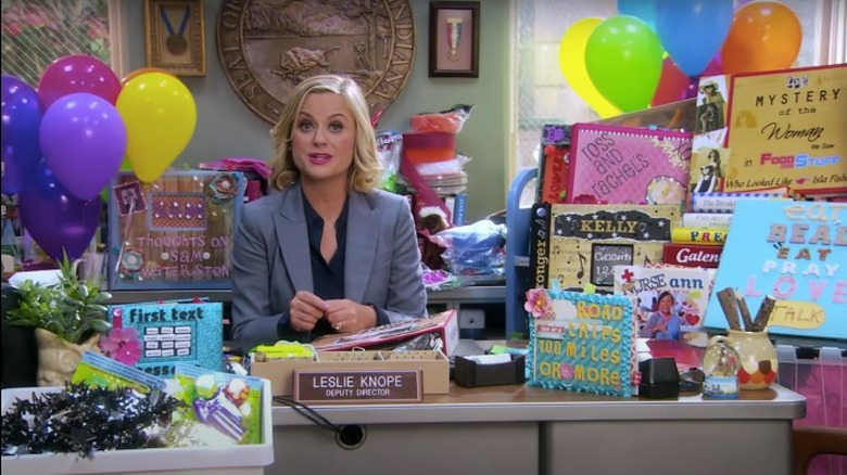 Leslie Knope surrounded by gifts