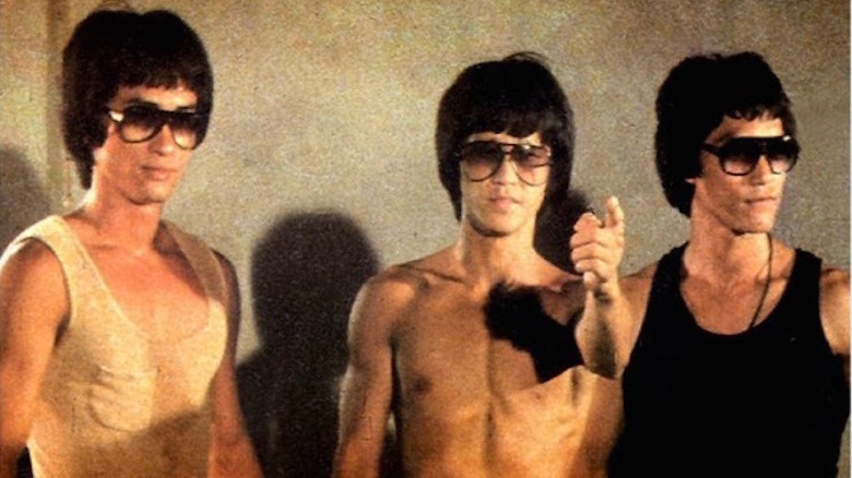 Three Bruce Lee clones, including Bruce Le, wear sunglasses