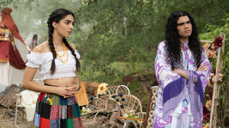 Latika and Carlos dressed as hippies in The Winchesters