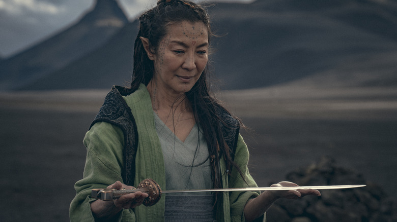 Michelle Yeoh holding sword