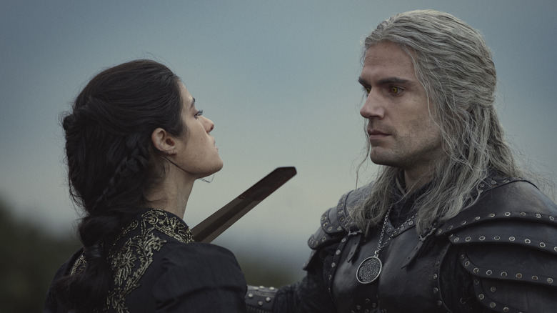 Geralt holding his blade to Yen's neck