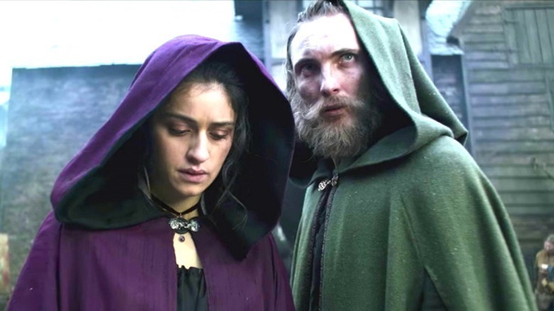 Yennefer and Cahir wearing cloaks