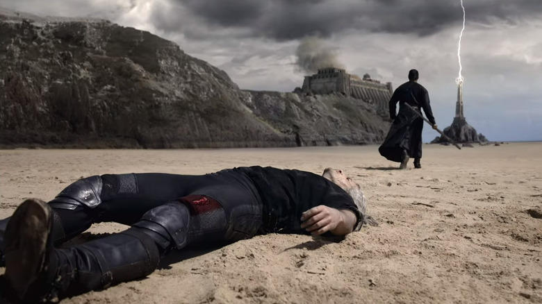 Geralt lying defeated on beach