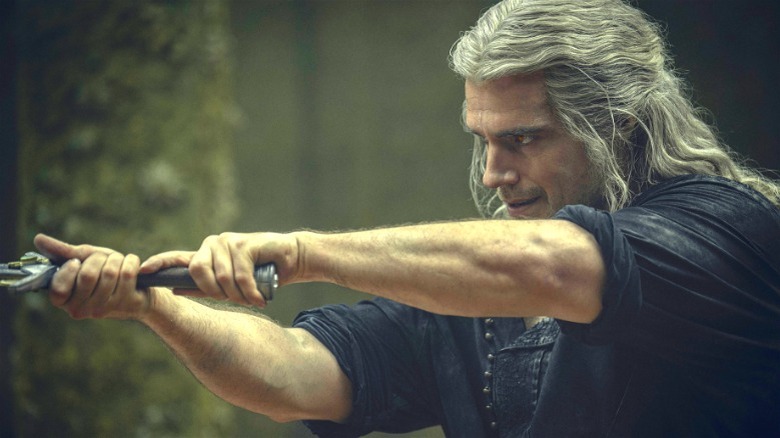 Geralt holding a sword