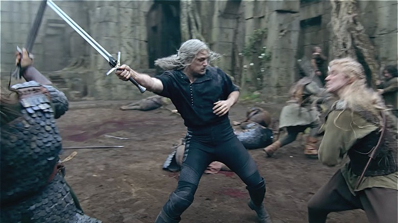 Geralt fighting with sword raised