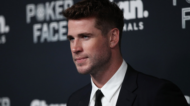 Liam Hemsworth looking to the side