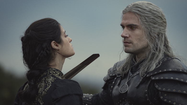 Geralt holding blade to Yennefer's throat