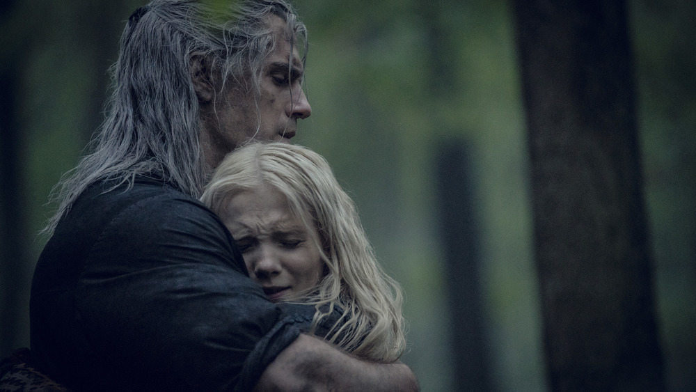 Geralt of Rivia hugging Ciri tightly in The Witcher