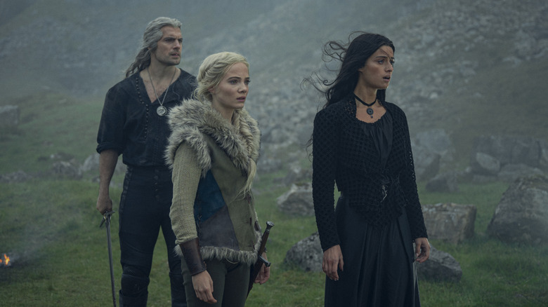 Yennefer, Ciri, and Geralt on a mountainside