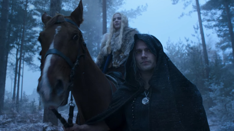 Geralt leading Ciri on Horseback