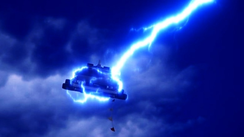 The DeLorean being struck by lightning.