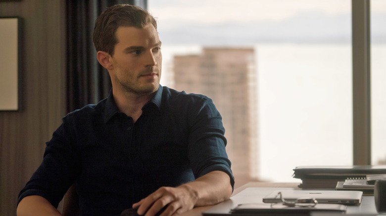 Christian Grey at his desk