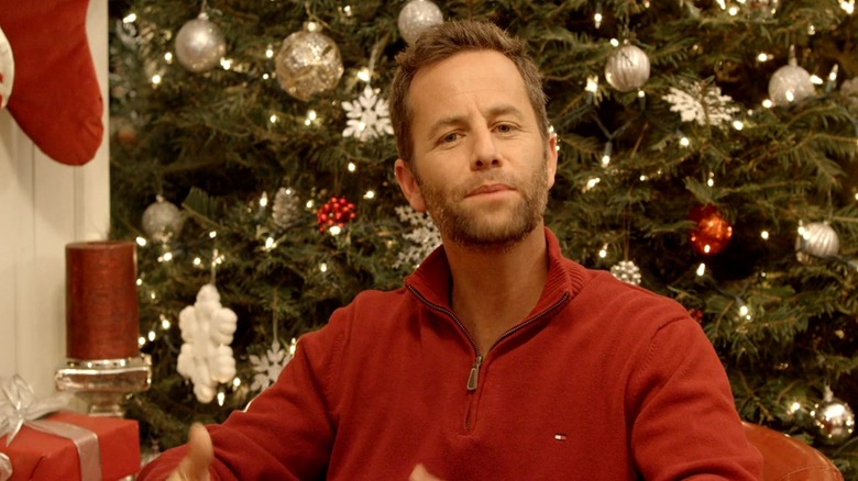 Kirk Cameron in front of Christmas tree