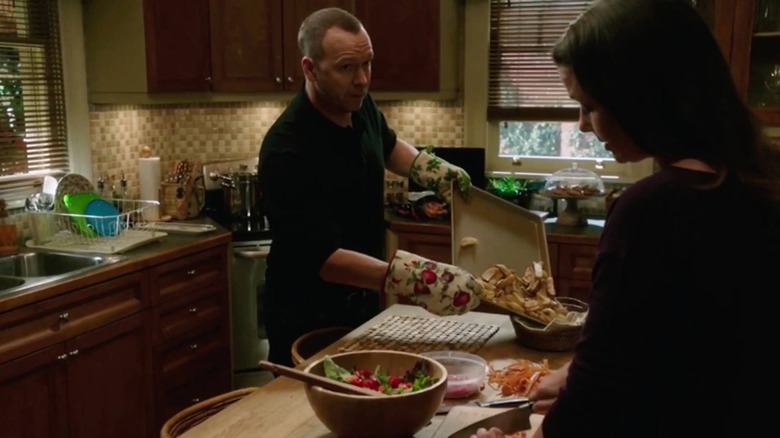 Danny Reagan handling potatoes